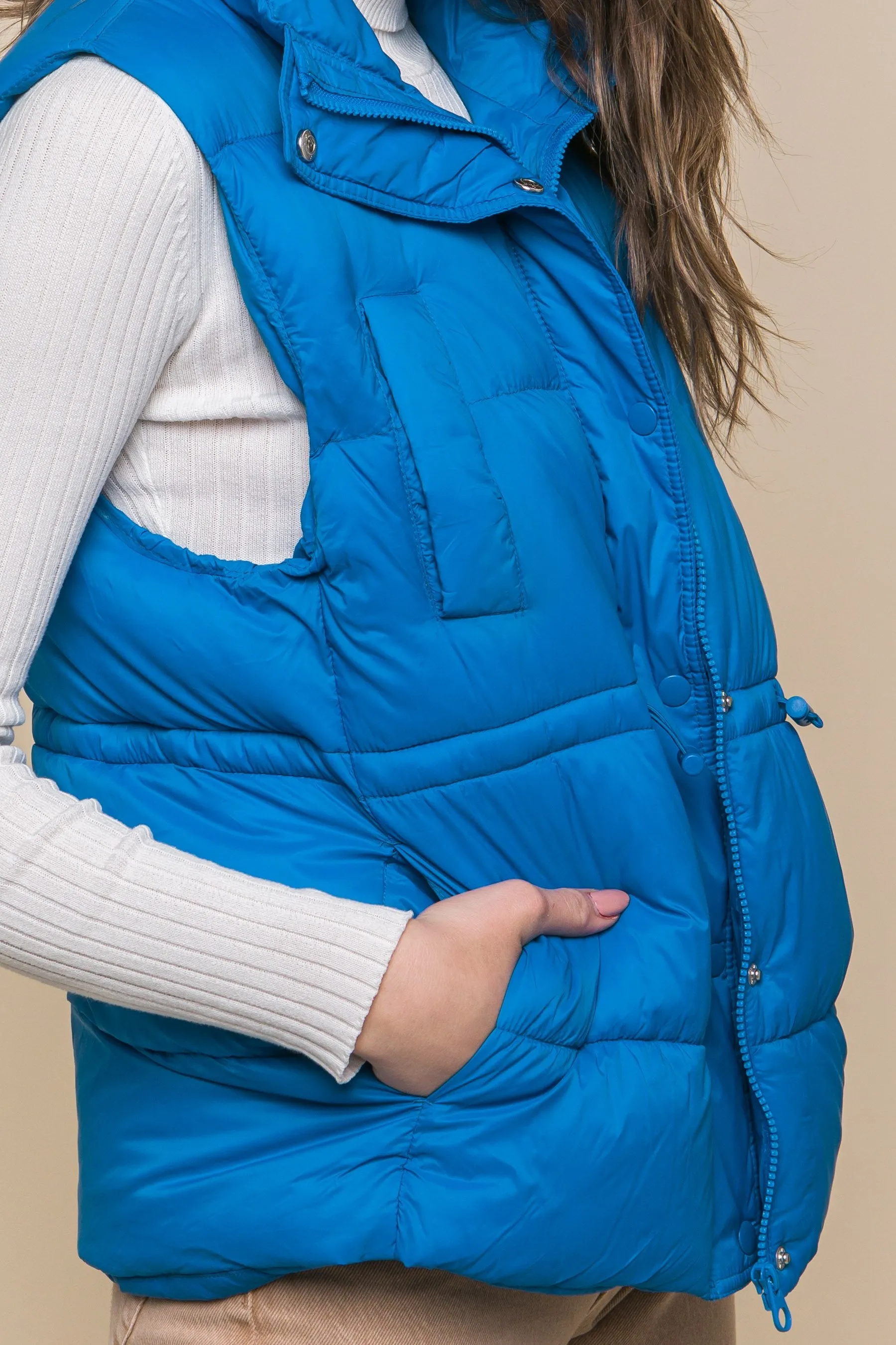 Women's Color Zip up button puffer vest with waist toggles