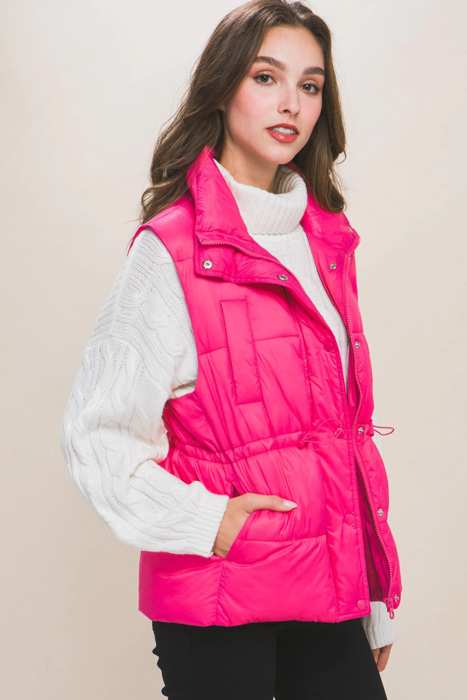 Women's Color Zip up button puffer vest with waist toggles